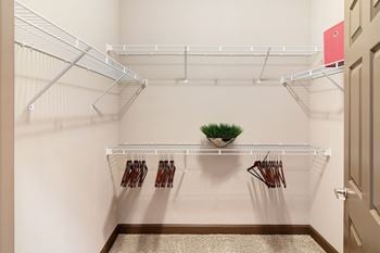 Our spacious walk in closets stocked with clothes hanger at kingston crossing apartment homes in bossier city la