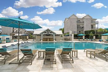 Pool and outdoor lounge amenity at parkwest apartment homes in hattiesburg mississippi