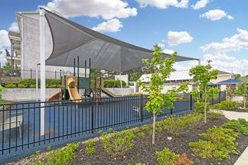 A pool with a canopy over it next to a building