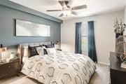 Hattiesburg apartment for rent - create a cozy bedroom with a comfy bed and ceiling fan at Parkwest Apartment Homes, Mississippi, 39402