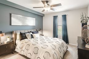 Hattiesburg apartment for rent - create a cozy bedroom with a comfy bed and ceiling fan at Parkwest Apartment Homes, Mississippi, 39402