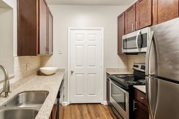 Kitchen with stainless steel appliances and granite countertops
