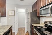 Brandon apartment for rent - a kitchen with stainless steel appliances and granite counter tops at Lakeshore Pointe Apartment Homes, Brandon, MS, 39047