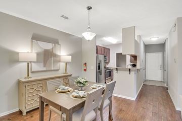 Flowood apartment for rent - a kitchen and dining room with a table and chairs