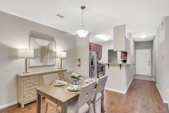 Flowood apartment for rent - a kitchen and dining room with a table and chairs at Ashford Place Apartment Homes, Mississippi