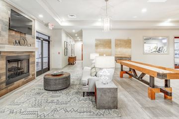 Oxford apartment for rent - the preserve at ballantyne commons living room with fireplace and table
