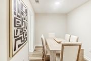 Olive Branch apartment for rent - a dining room with a table and chairs and a painting on the wall at The Oliver Apartment Homes, Olive Branch, MS