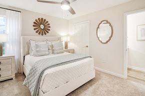 Olive Branch apartment for rent - a bedroom with a white bed and a mirror at The Plantation Apartment Homes, Mississippi, 38654