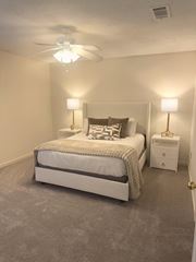 Oxford apartment for rent - A bedroom with a bed, nightstand, and two lamps.