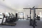 Flowood apartment for rent - A gym with treadmills, elliptical machines, and weight machines at Carlton Park Apartment Homes in Flowood, Mississippi