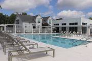 Brandon apartment for rent - A pool with sun loungers and a building in the background.