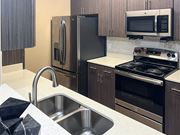 Shreveport apartment for rent - a kitchen with stainless steel appliances and a sink at Canebrake Apartment Homes in Louisiana, 71115