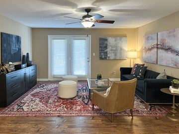 Bossier City apartment for rent - a living room with furniture and a ceiling fan at Reserve of Bossier City Apartment Homes in Bossier City, LA 71111