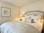 Gautier apartment for rent - A bed with white pillows and a grey headboard is in the image at The Pointe Apartment Homes, Gautier, 39553
