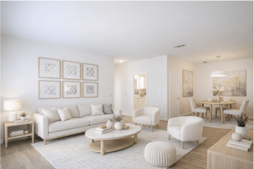 Tyler apartment for rent - A living room with a white sofa, a coffee table, and a dining table with chairs.