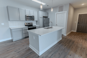 Greenwood apartment for rent - an open kitchen with a large island at The Village at Sandstone Apartments, Greenwood, 46142