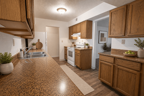 Kalamazoo apartment for rent - A kitchen with wooden cabinets and a brown countertop.