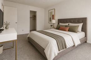 Kalamazoo apartment for rent - A bedroom with a large bed and a television.