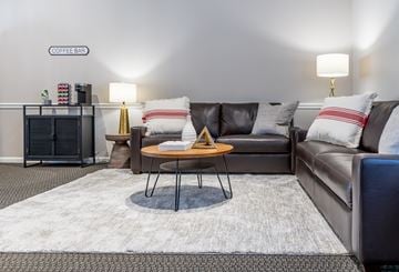 Louisville apartment for rent - a living room with couches and a coffee table
