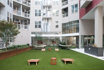 Spacious courtyard with greenspace, games, and a cozy fireplace 