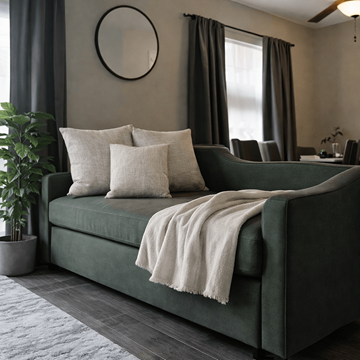 Indianapolis apartment for rent - A green couch with a white throw blanket and pillows in a living room.