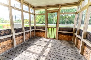 Porch with a tub and windows