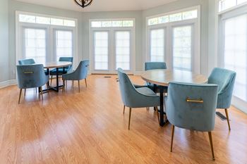 A conference room with a large table and chairs