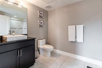 Bathroom with a toilet and towel rack
