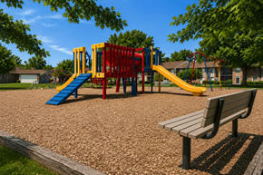 Indianapolis apartment for rent - A playground with a slide, swings, and a bench.