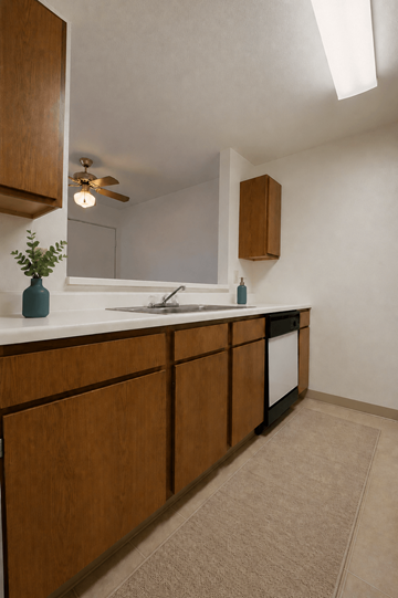 Indianapolis apartment for rent - A kitchen with wooden cabinets and a white countertop.