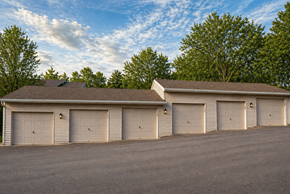 Springboro townhouse for rent - A large building with a brown roof and six garage doors.