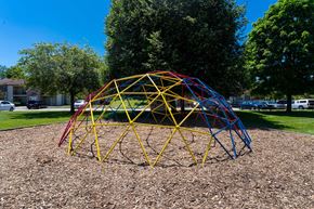 Indianapolis apartment for rent - a pyramid of playground equipment in a park at Creekside Square Apartments, Indianapolis, IN