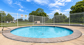 Kokomo apartment for rent - A small round pool surrounded by a fence.