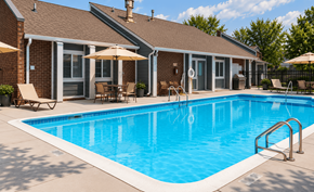 Louisville apartment for rent - A pool in front of a house with a patio and chairs.