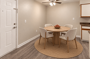 Kokomo apartment for rent - A dining room with a round table and chairs.