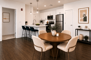 Indianapolis apartment for rent - A modern kitchen with a dining table set for two.