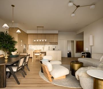 Miami apartment for rent - A modern living room with a dining table and chairs.