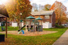 Northampton apartment for rent - A playground with a green slide and a red slide.