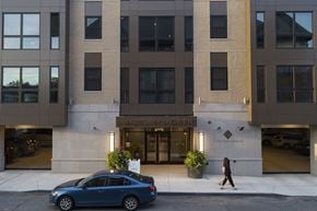 Buffalo apartment for rent - a car is parked in front of the entrance to the ninnien north building at Nineteen North, Buffalo, 14202