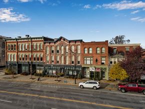 Buffalo apartment for rent - Historic brick building storefronts and street view at The Granite Works Apartments, New York, 14202