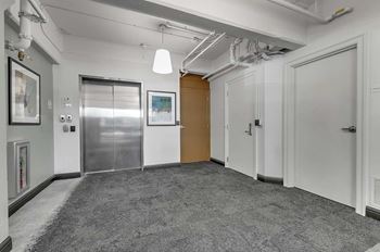 Building corridor with elevator and entrance doors