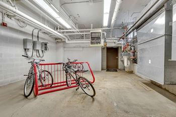 Bike storage room with mechanical systems and concrete floor