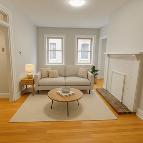 Pittsburgh apartment for rent - A living room with a white couch, a coffee table, and a lamp.