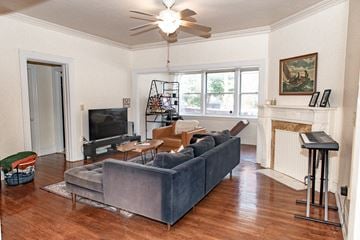 Pittsburgh apartment for rent - A living room with a grey couch and a television.