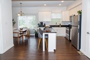 Pittsburgh townhouse for rent - A kitchen with a dining table and chairs. at Highland Village, Ross Township, Pittsburgh, PA 15229