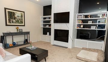 Pittsburgh apartment for rent - A living room with a fireplace and a painting on the wall.