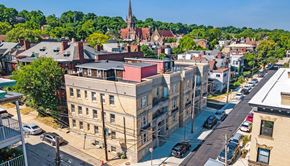 Pittsburgh apartment for rent - an aerial view of a city with a church in the background