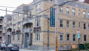 Pittsburgh apartment for rent - a large brick building with a sign on the side of it