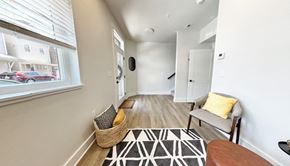 Pittsburgh apartment for rent - a living room with a couch and a chair next to a window