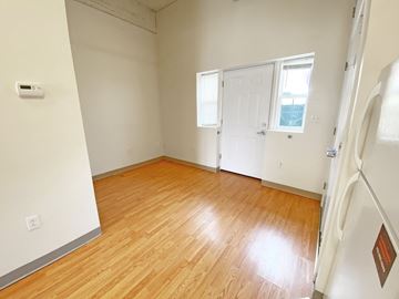 Pittsburgh apartment for rent - a bedroom with wood floors and a white door